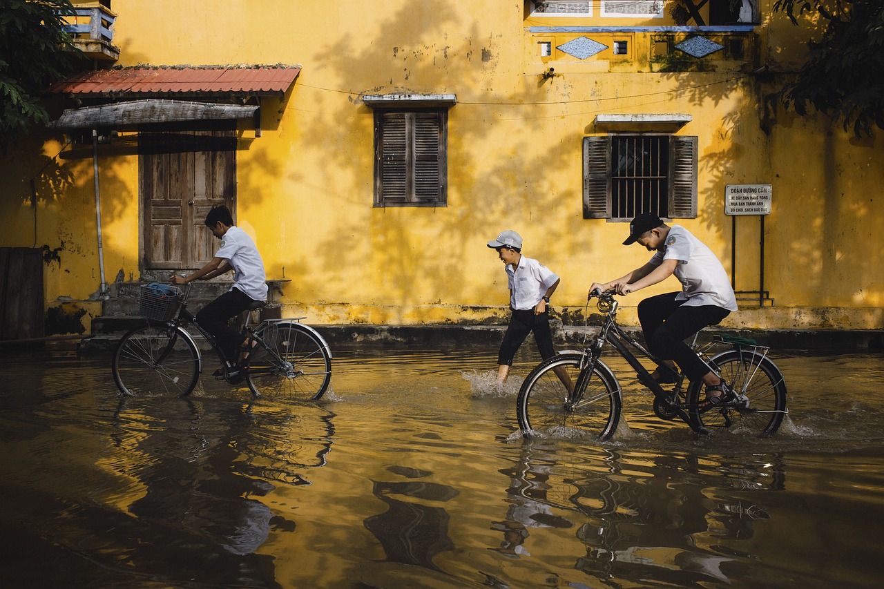 children, bicycles, flood