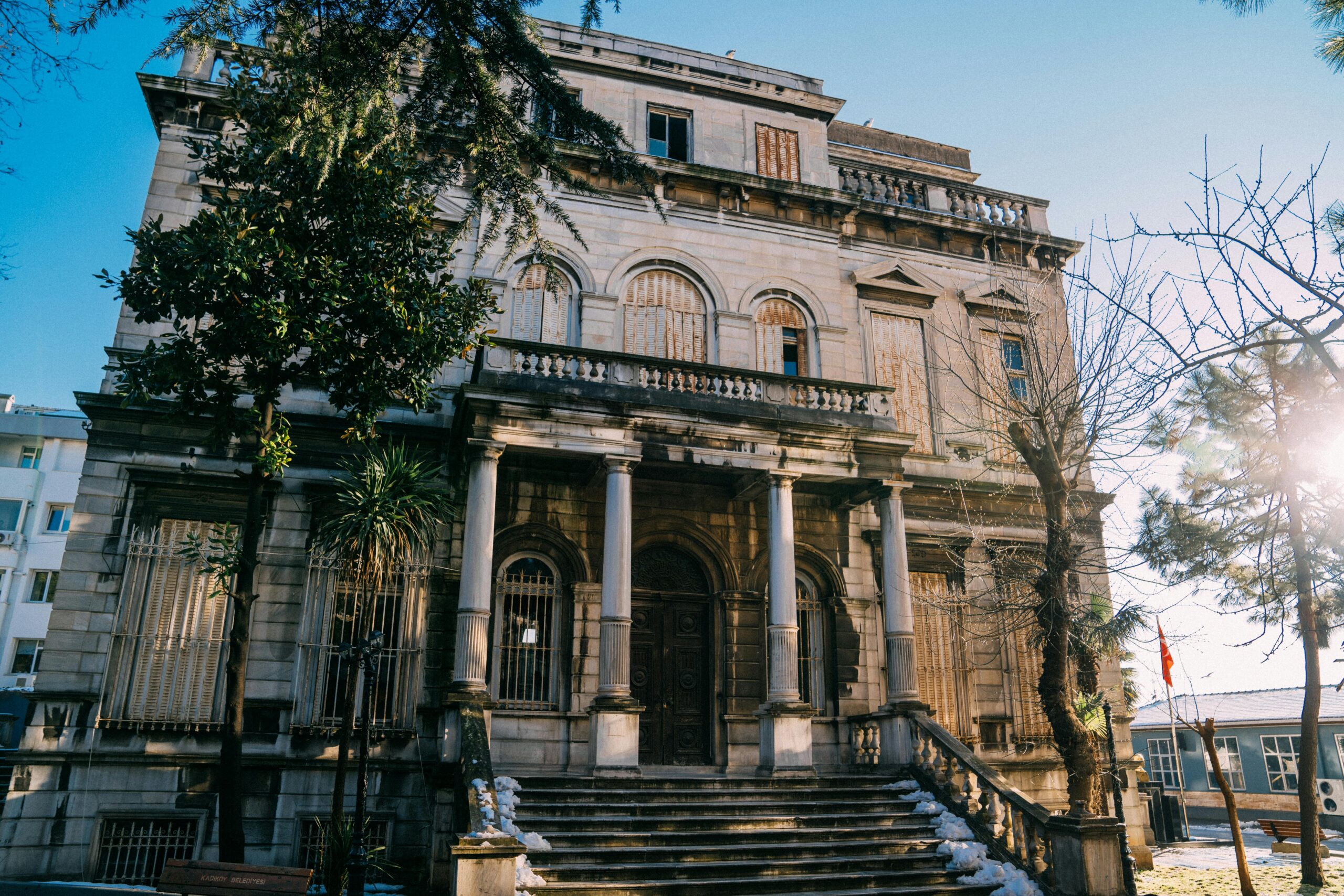 A weathered, historic building facade in Istanbul during a sunny winter day.