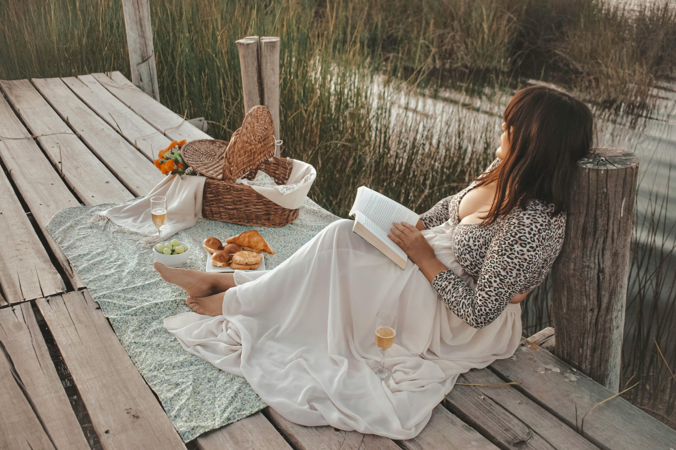 Girl Sitting On the Pier with a Book