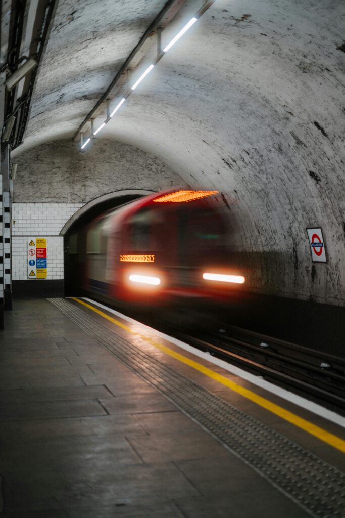 London Train rushing through a tube station