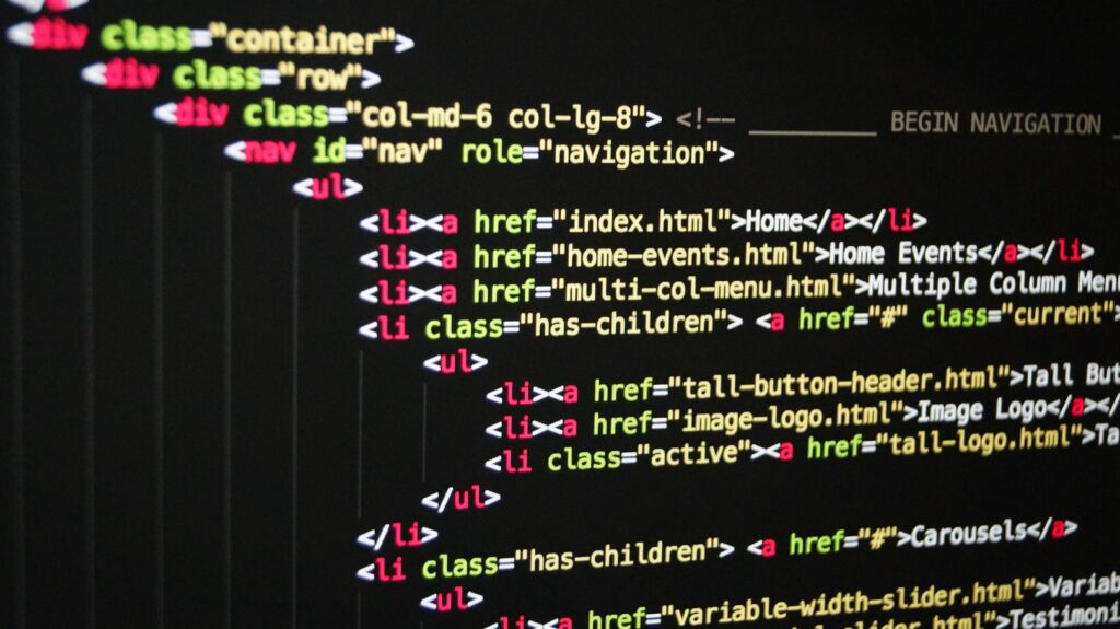 Close-up of vibrant HTML code displayed on a computer screen, showcasing web development and programming.