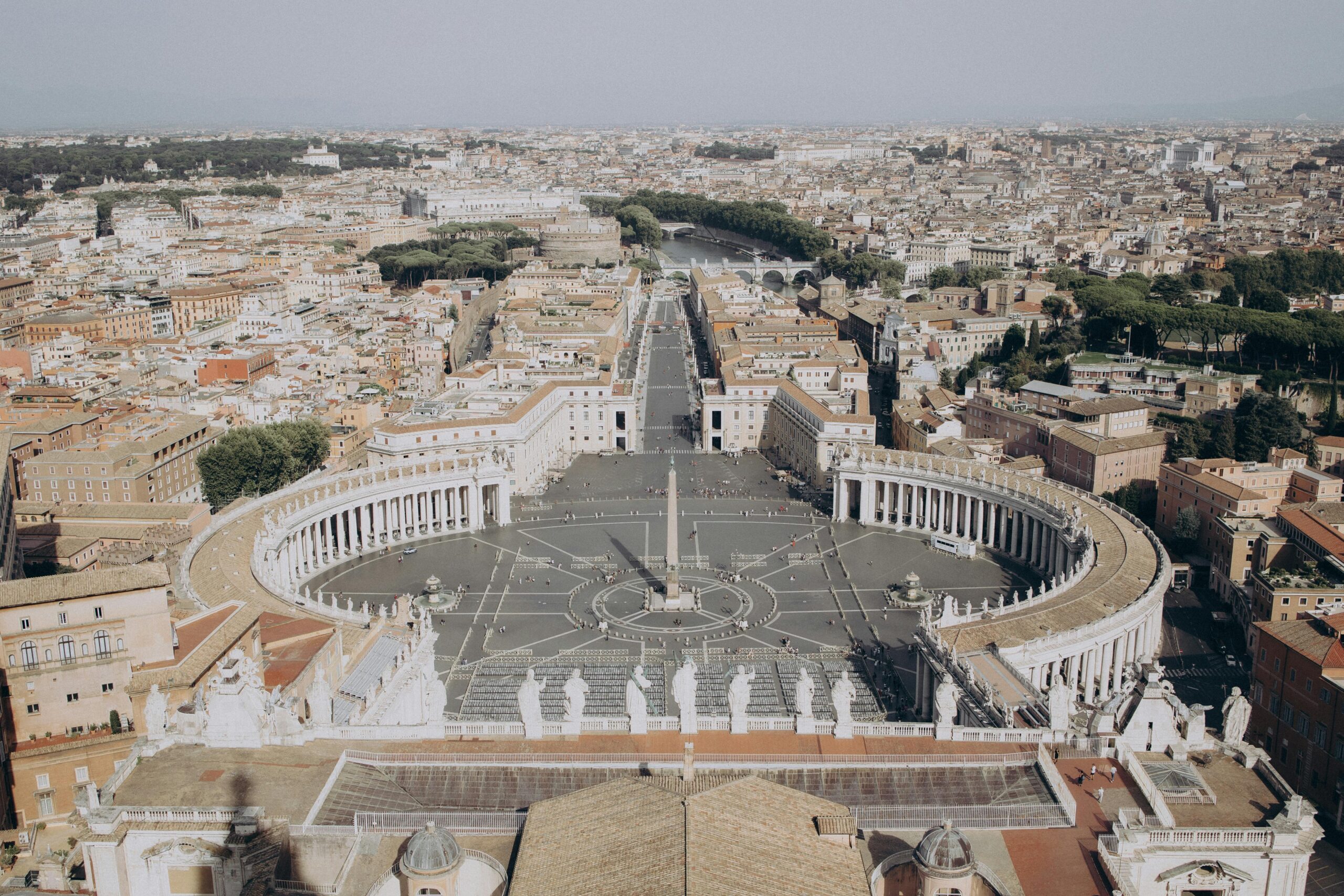 Stunning aerial view of St. Peter's Square in Vatican City showcasing iconic architecture.