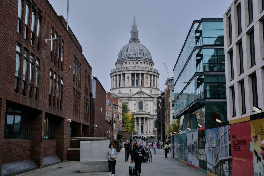 Street view of St Paul's Cathedral surrounded by urban architecture, London.