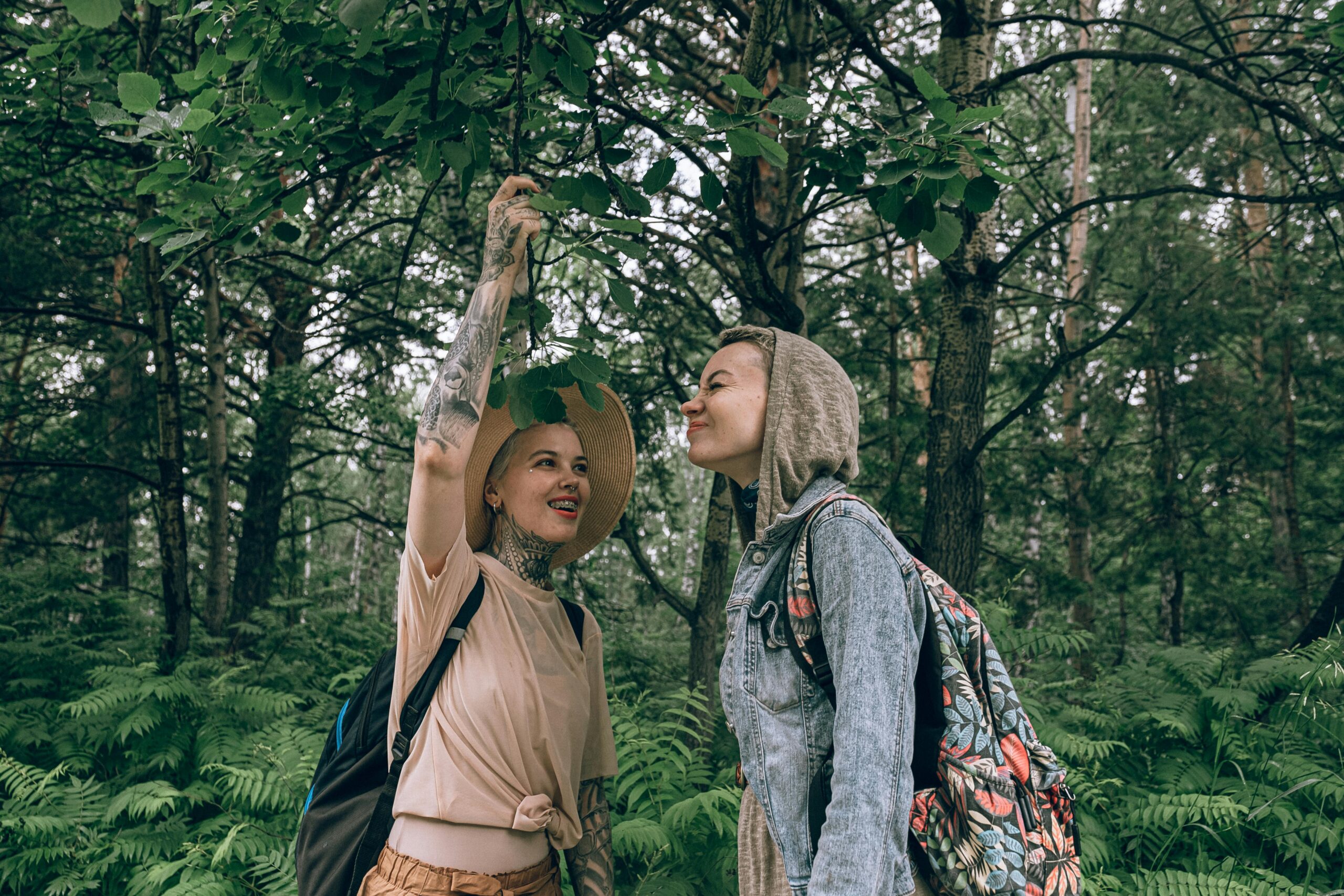 Photo of Women Standing Near Green Leaves