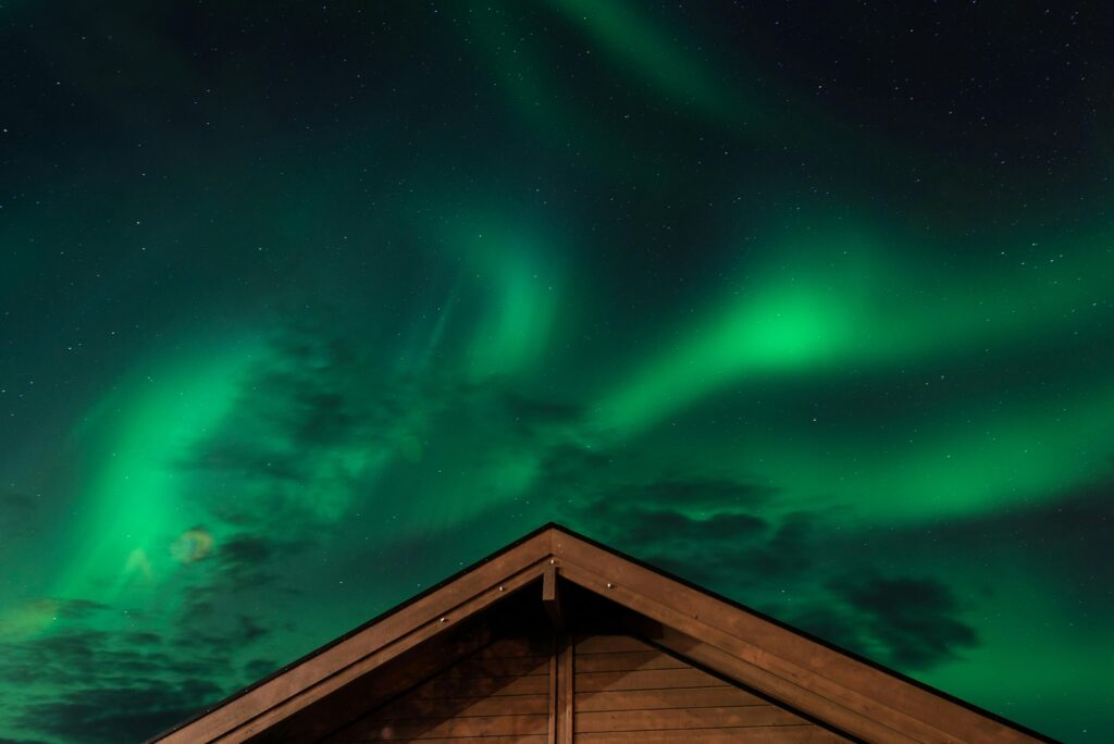 Brown House Under Aurora Lights