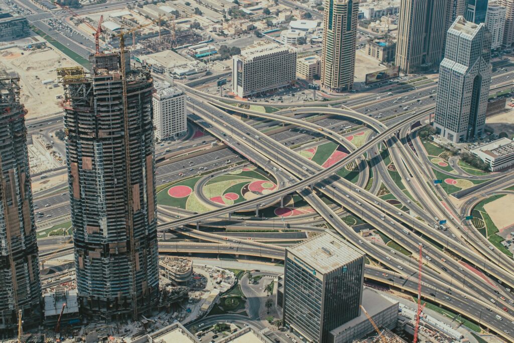 Explore Dubai's intricate roadways and futuristic skyline in this stunning aerial shot.