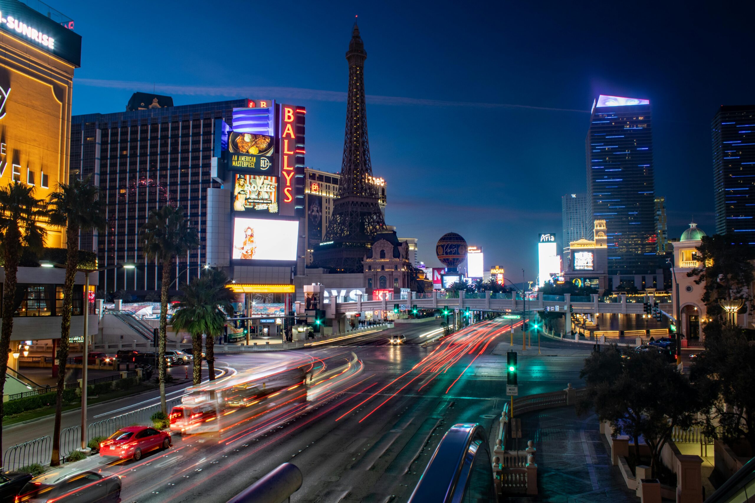 Captivating night view of Las Vegas Strip with vibrant traffic and iconic hotels.