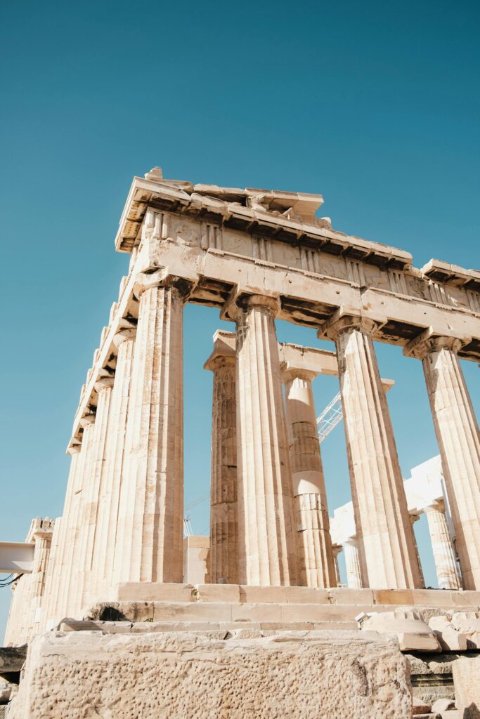 Stunning low-angle shot of the iconic Parthenon in Athens, capturing its ancient architectural beauty.