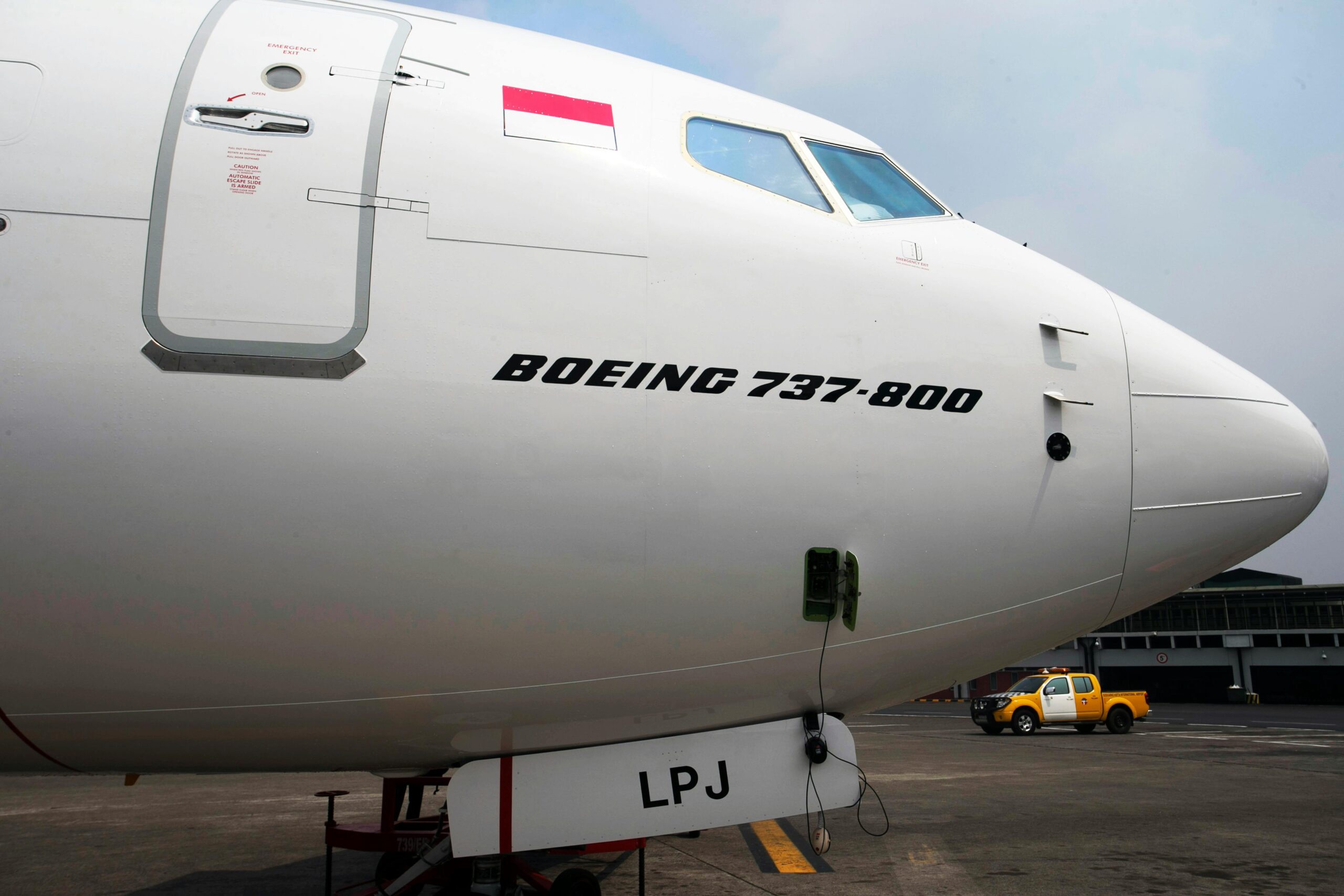 Detailed view of a parked Boeing 737-800 aircraft by Lion Airlines at the airport.