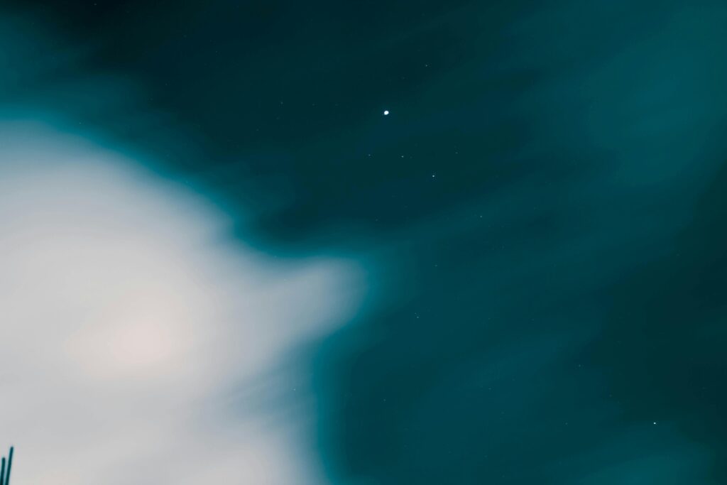 A mesmerizing view of the night sky with clouds and stars in Karachi, Pakistan.