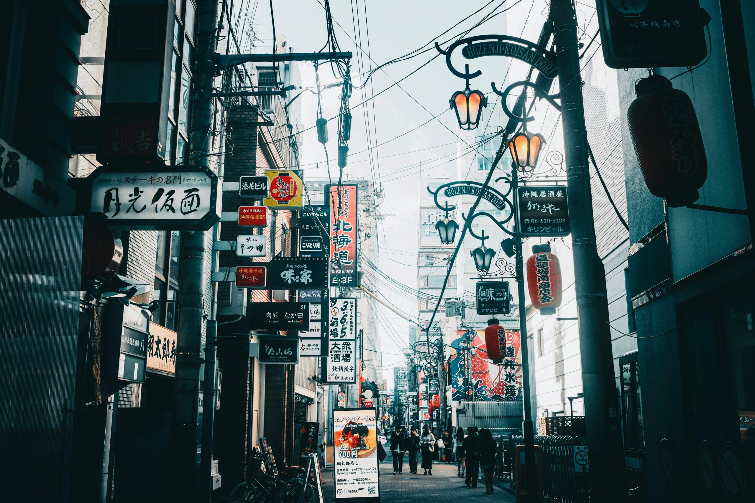 Vibrant street scene in Japan showcasing neon signs and urban life.