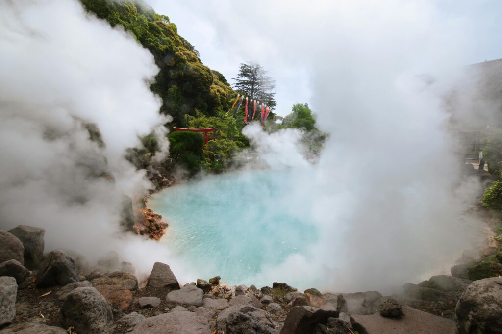 Geothermal hot spring with steam and rocky surroundings in Beppu, Japan, famous for its hot spring hells.