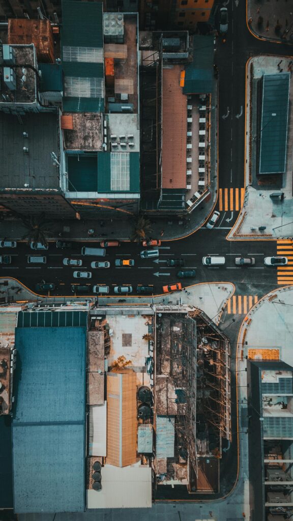 Overhead view of bustling streets and buildings in Kuala Lumpur, highlighting urban life.