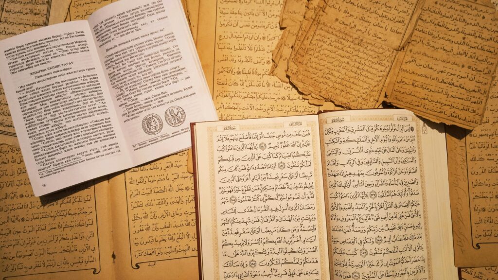 Open books with Arabic and Russian writings on ancient manuscripts, capturing historical knowledge.