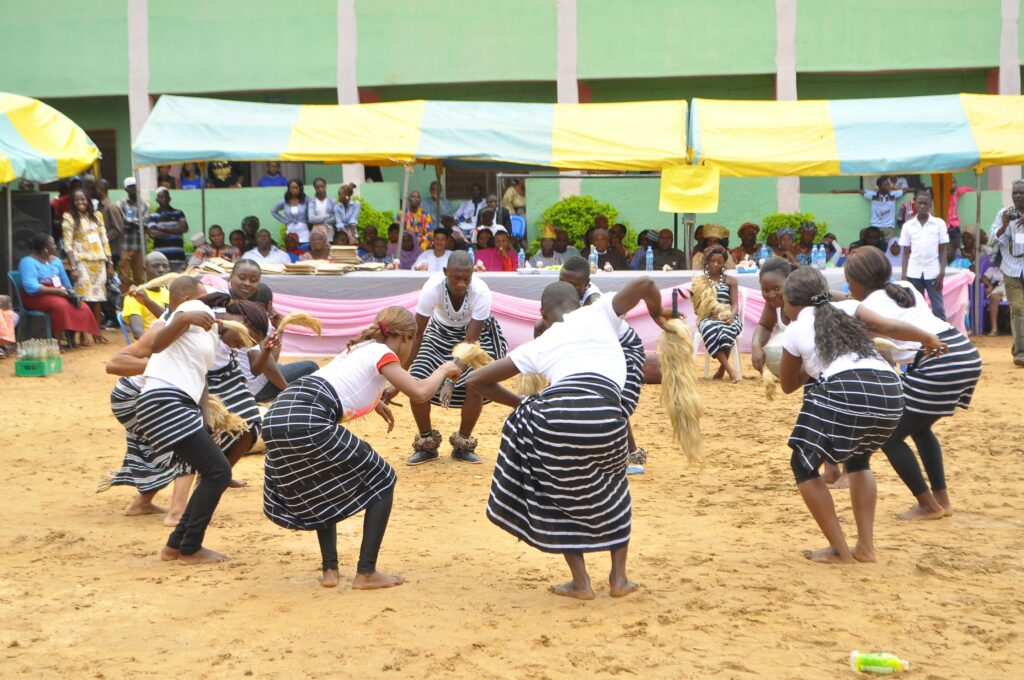 Vibrant group of dancers performing traditional cultural dance in Kaduna, Nigeria.