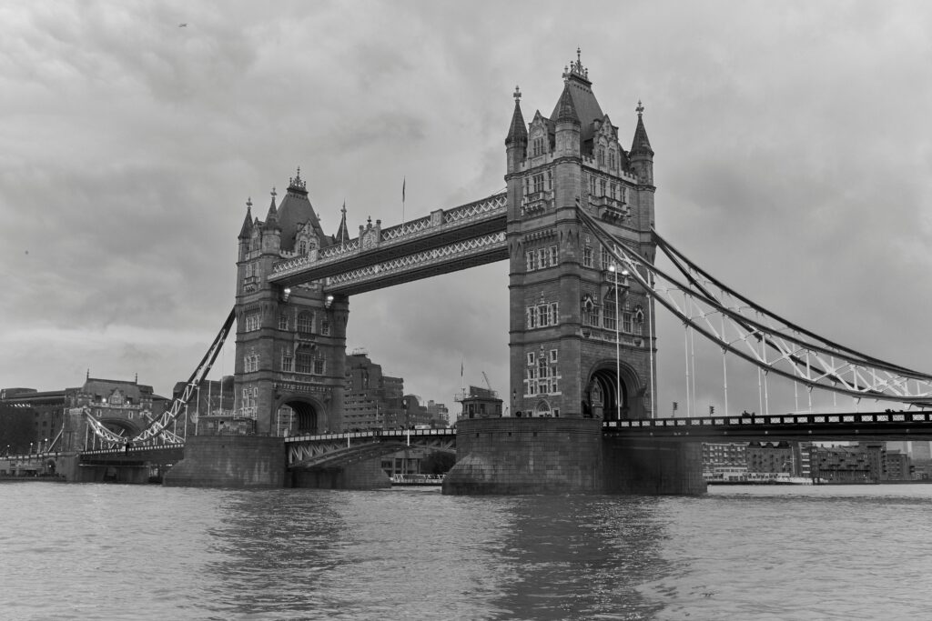 Black and white photograph capturing the iconic Tower Bridge in London, showcasing its stunning architecture.