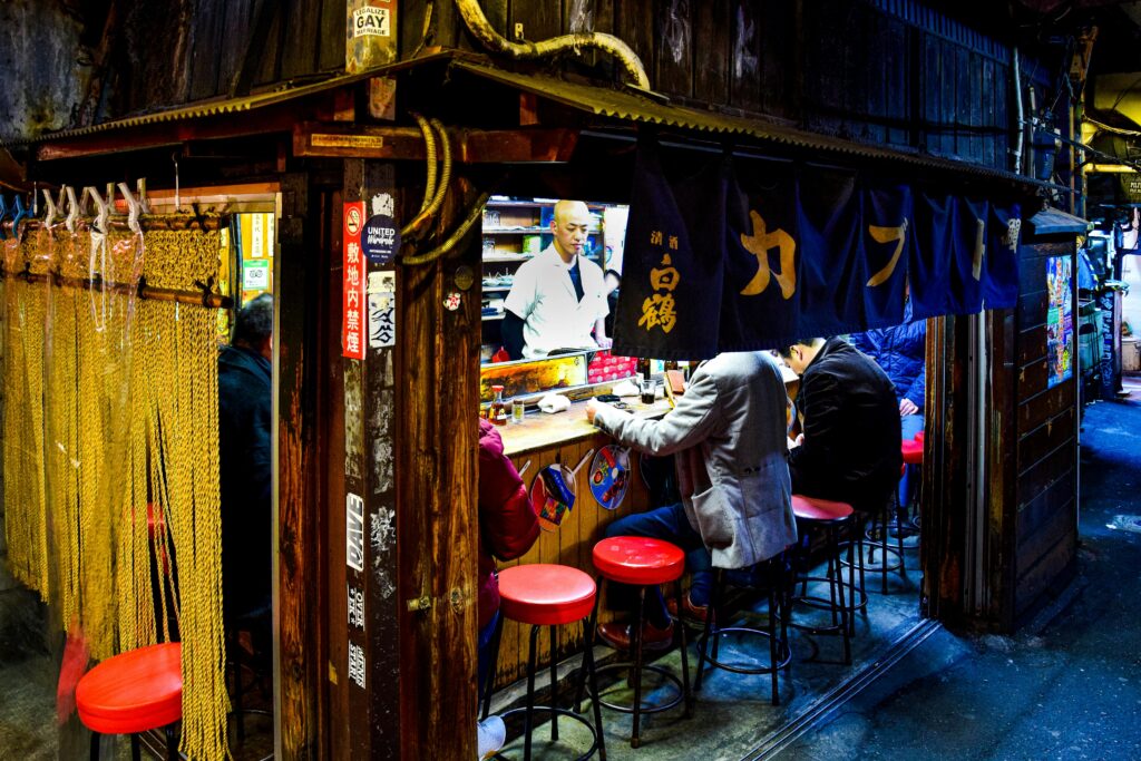 Experience the vibrant nightlife and dining culture in Tokyo's Omoide Yokocho, Shinjuku.