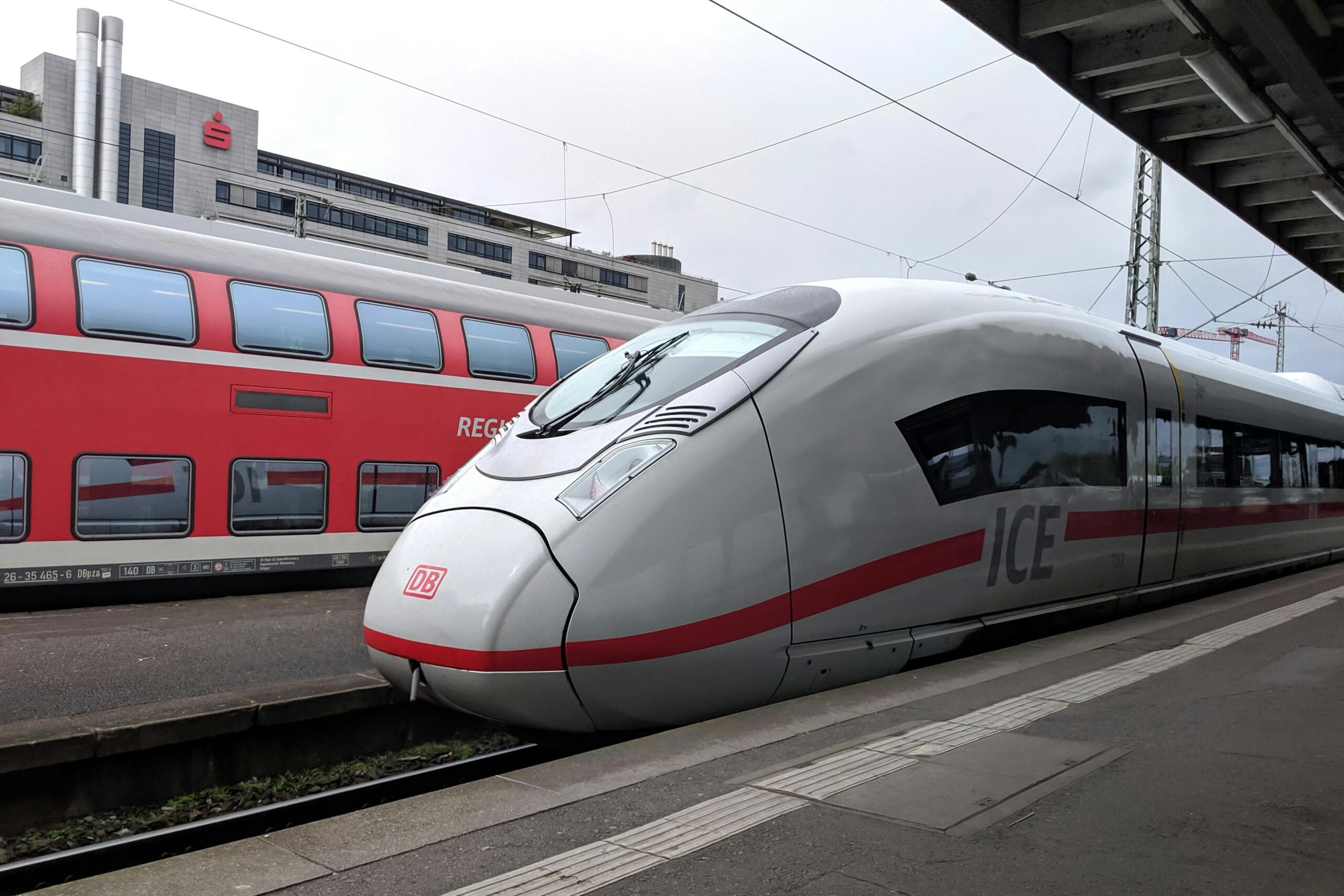 High-speed ICE and regional trains at Stuttgart station in Germany.