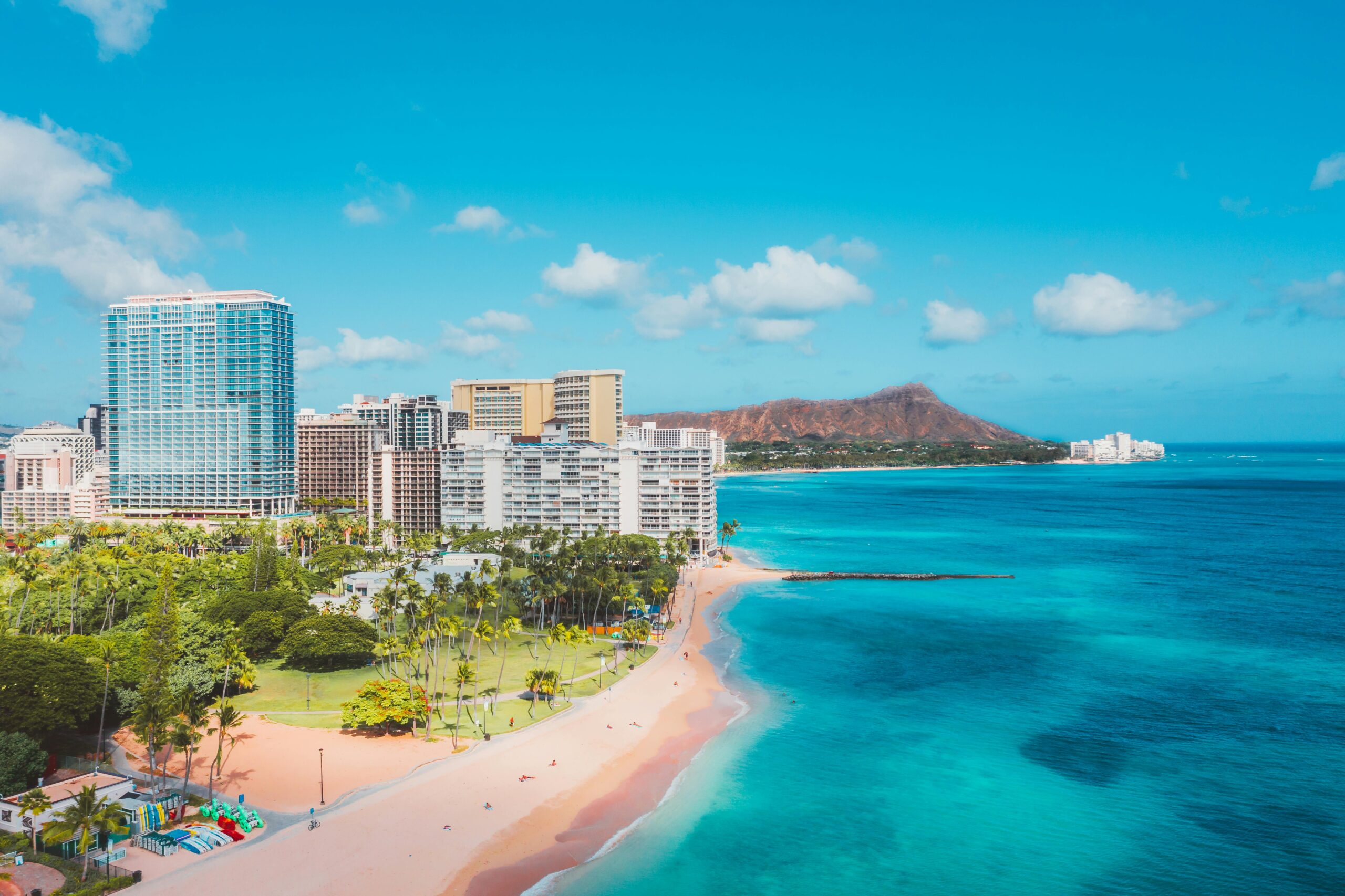 Stunning view of Waikiki Beach with Diamond Head in the background under a clear blue sky.