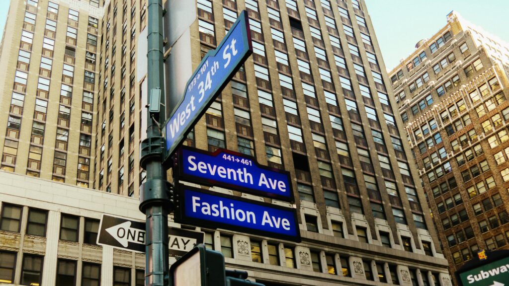 View of a street sign at West 34th and Seventh Avenue in downtown Manhattan, New York City.