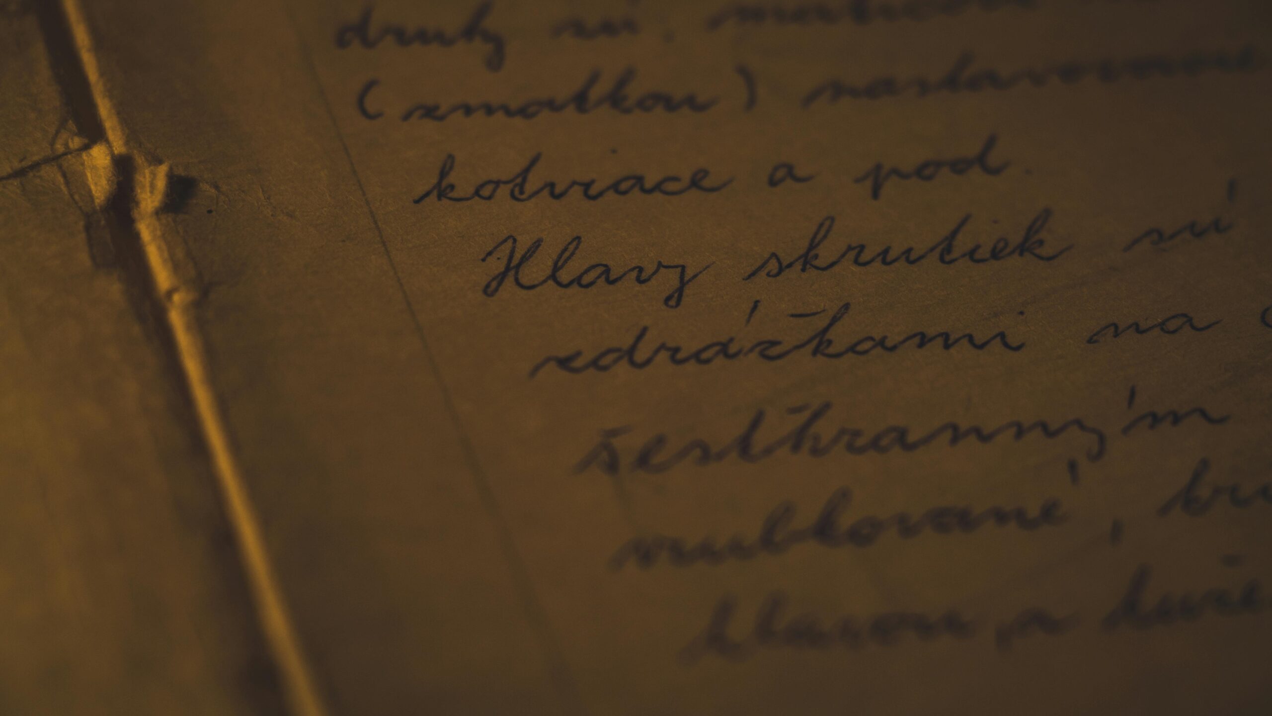 Detailed close-up of cursive handwriting on aged paper, evoking a nostalgic feel.