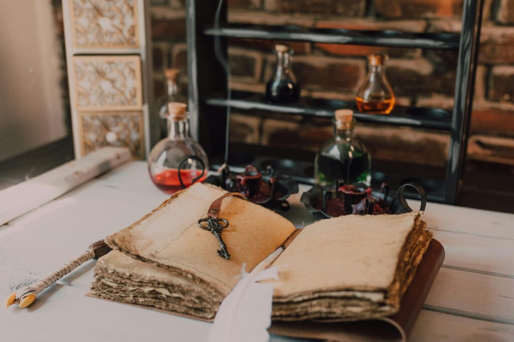 A vintage setting with old books, glass potion bottles, and a mystical vibe on a wooden table.