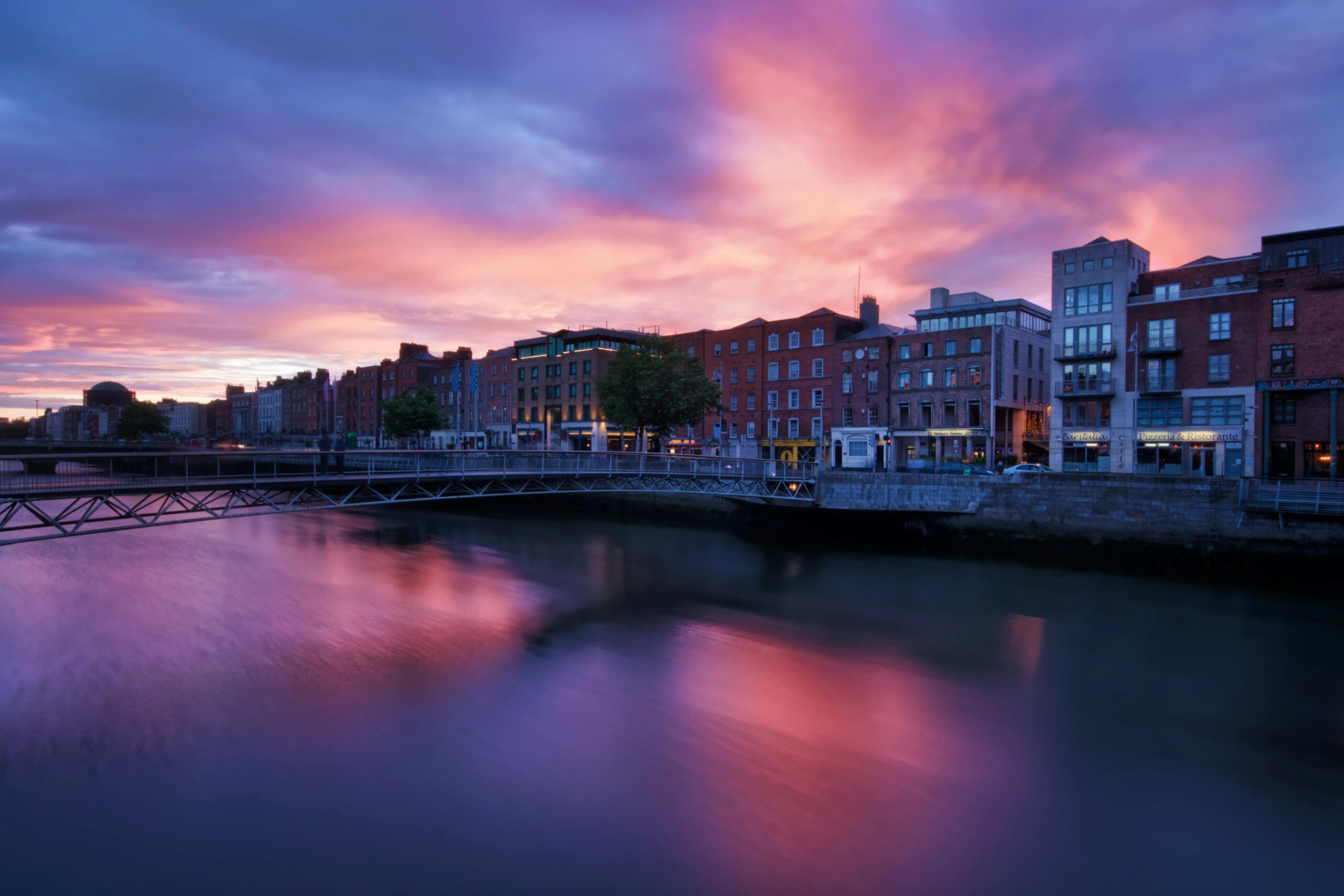 Beautiful sunset view over River Liffey and Dublin cityscape.