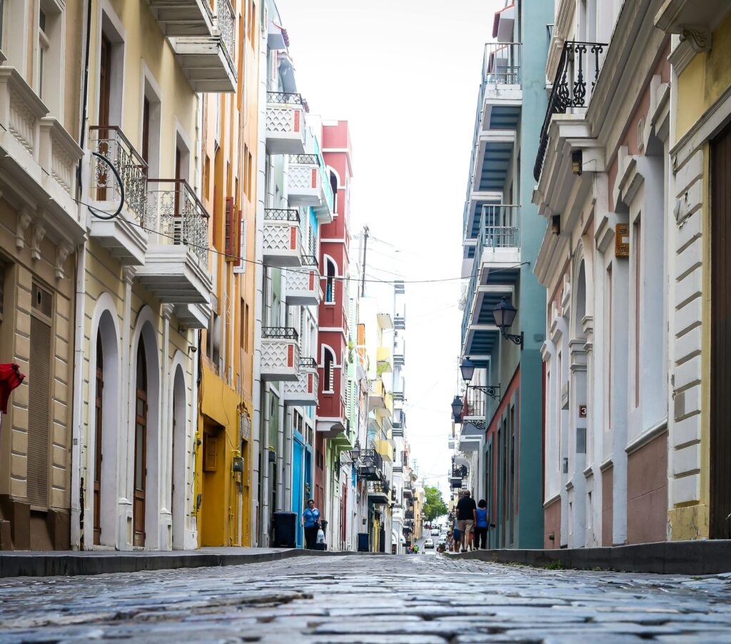 Vibrant colonial architecture lines a cobblestone street in Old San Juan, Puerto Rico.