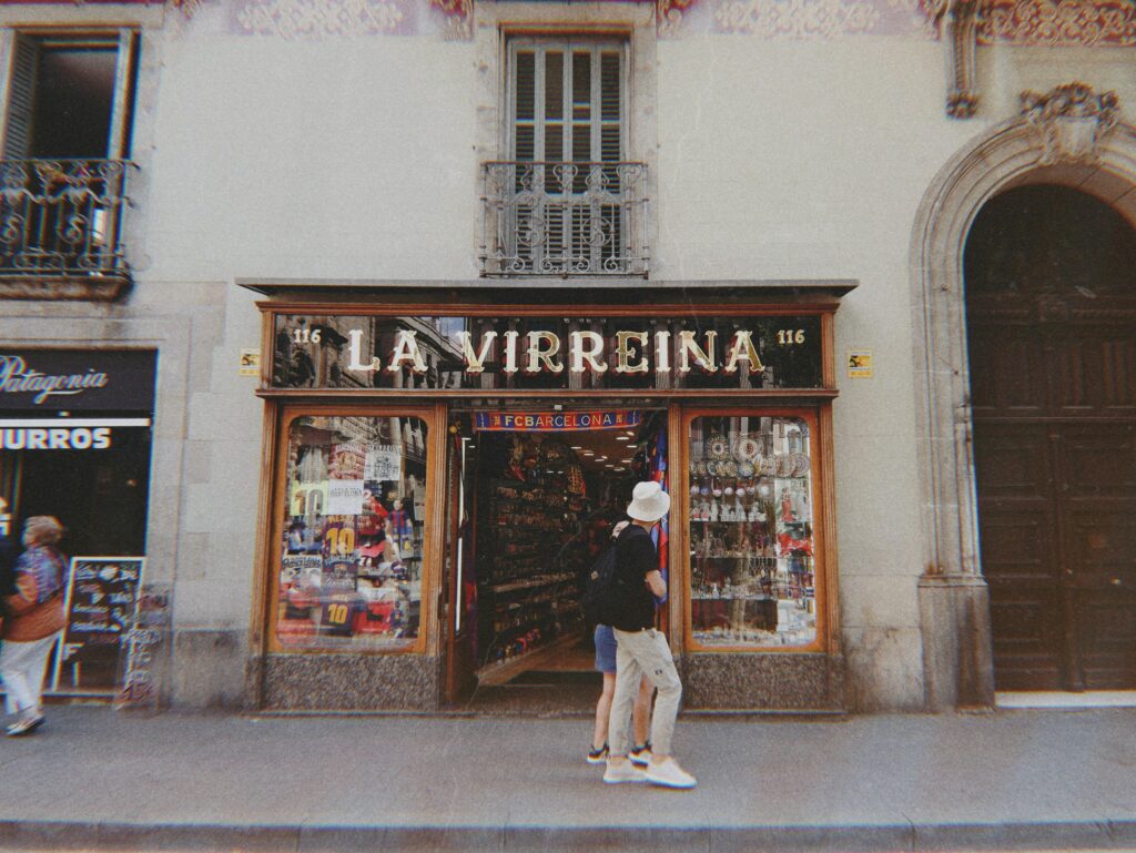 Explore the vibrant urban setting with the La Virreina store, bustling with people and unique architecture.