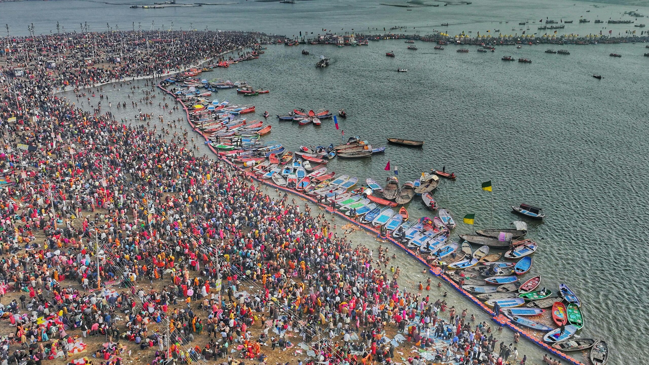 Arial view of crowds and boats during Kumbh Mela at Triveni Sangam, Prayagraj.