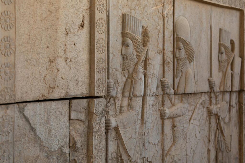 Intricate carvings on the walls of Persepolis, showcasing ancient Persian artistry.