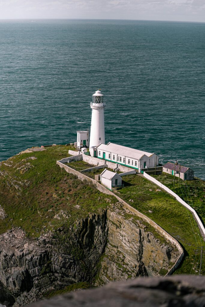 A scenic view of the South Stack Lighthouse on Anglesey's coastline, Holyhead, UK.