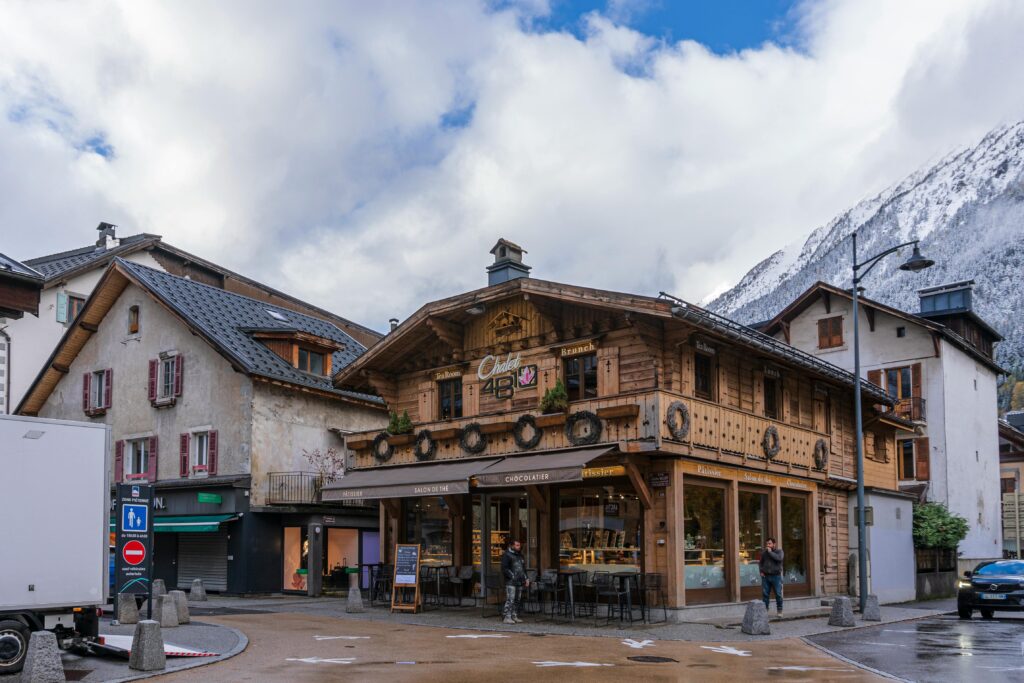 Quaint bakery in Chamonix, France against a scenic Alpine backdrop.