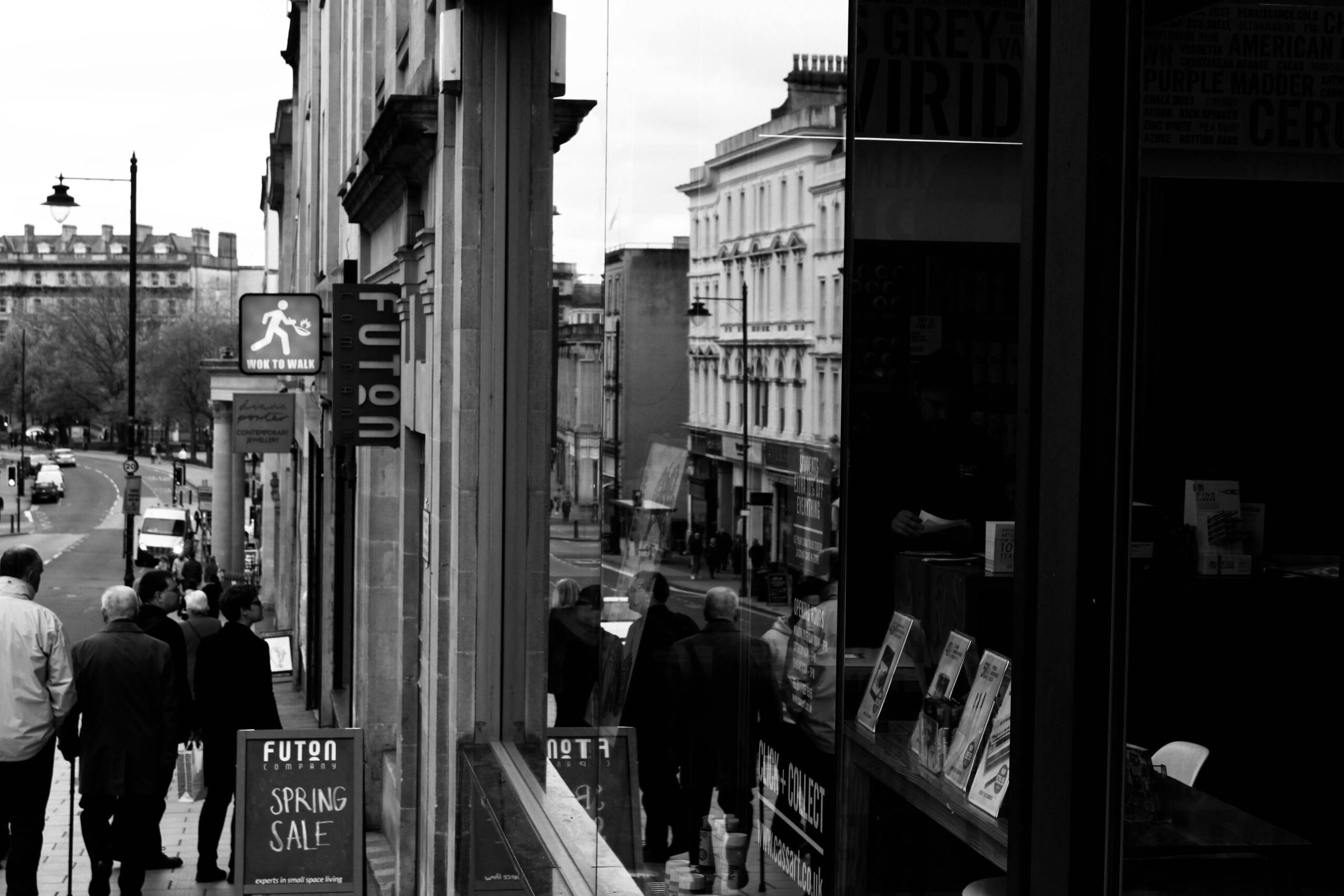 Monochrome street photograph capturing daily life in Bristol, England.