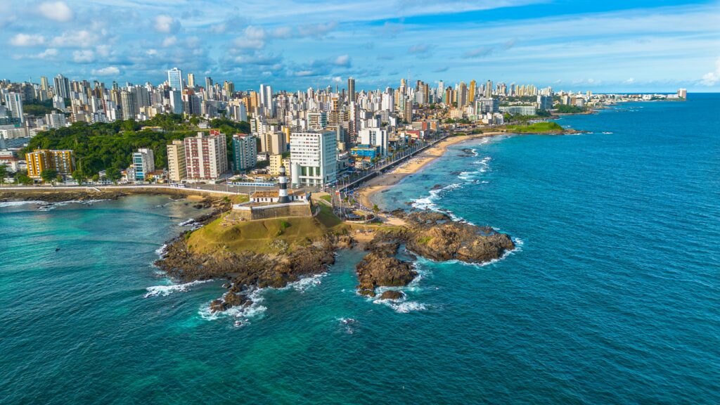 A vibrant aerial shot capturing Salvador, Bahia's coastline with its urban skyline and beach.