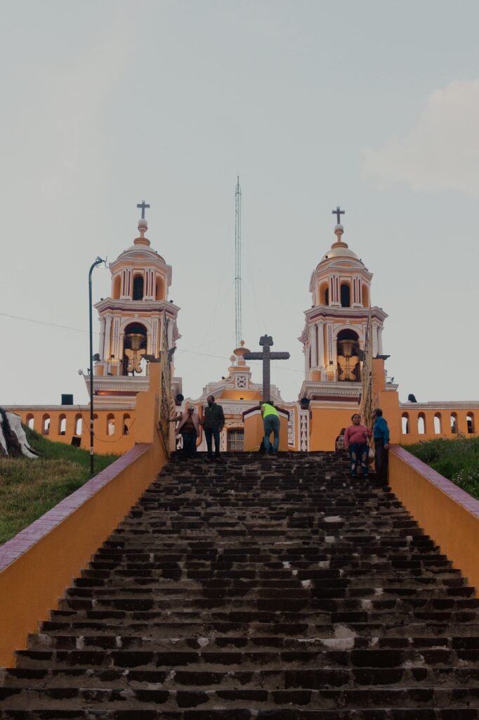 Iconic view of the Church of Nuestra Señora de los Remedios on a hilltop in Puebla, Mexico.