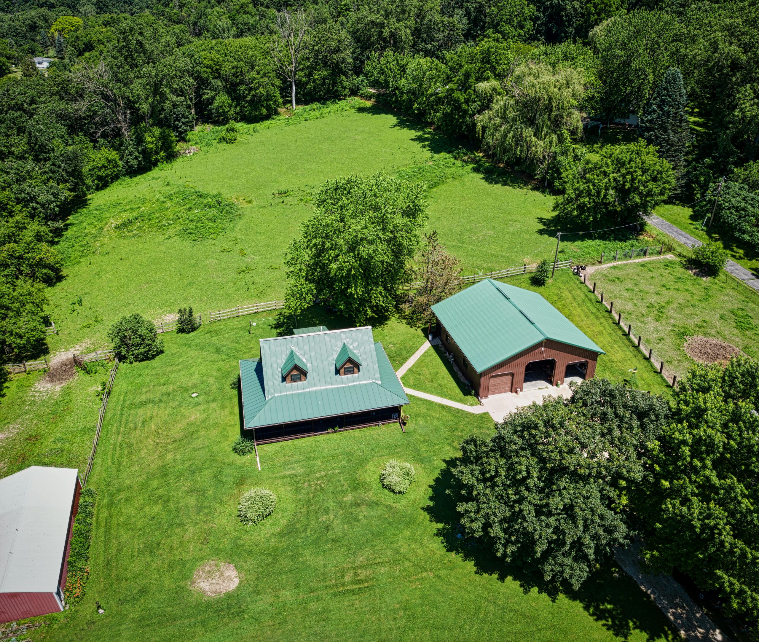 Aerial view of a countryside home in Dakota, Minnesota during summer.