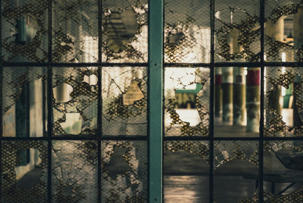 Eerie shot of shattered glass within the historic Alcatraz Prison in San Francisco.