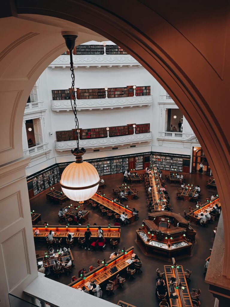 Inside the iconic State Library Victoria, showcasing Melbourne's stunning architecture and cultural vibrancy.