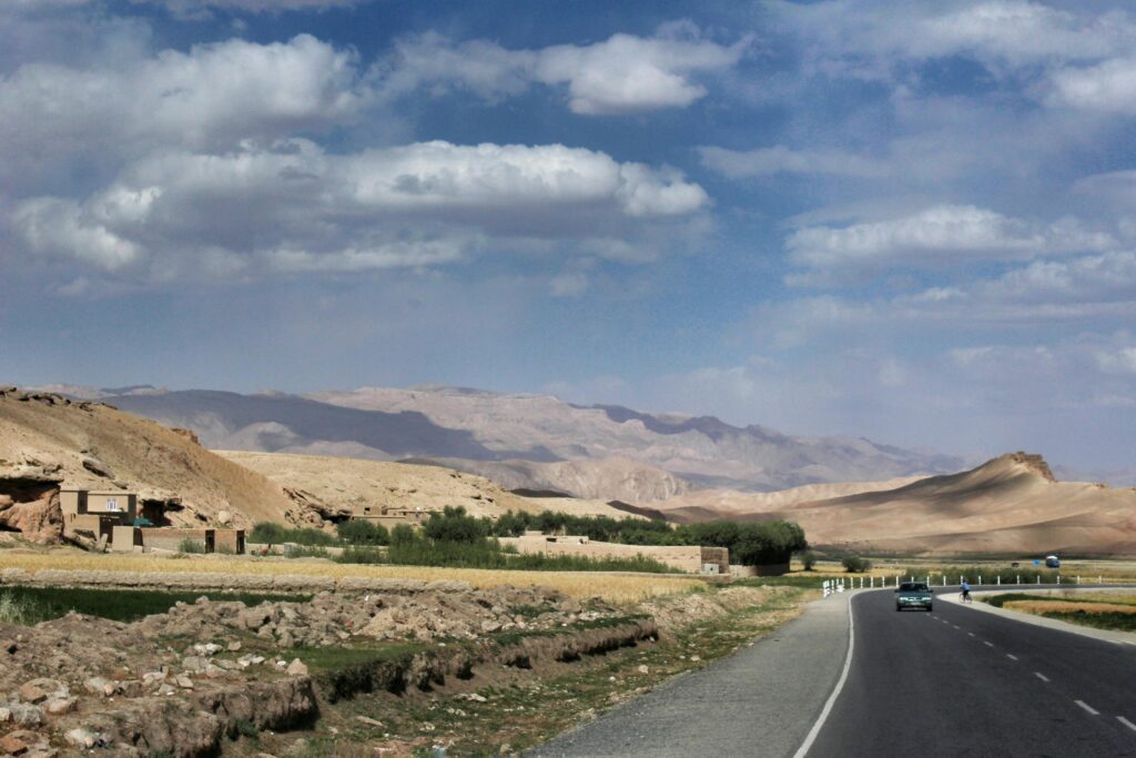 A road cutting through the beautiful mountainous landscape of Bamyan, Afghanistan.