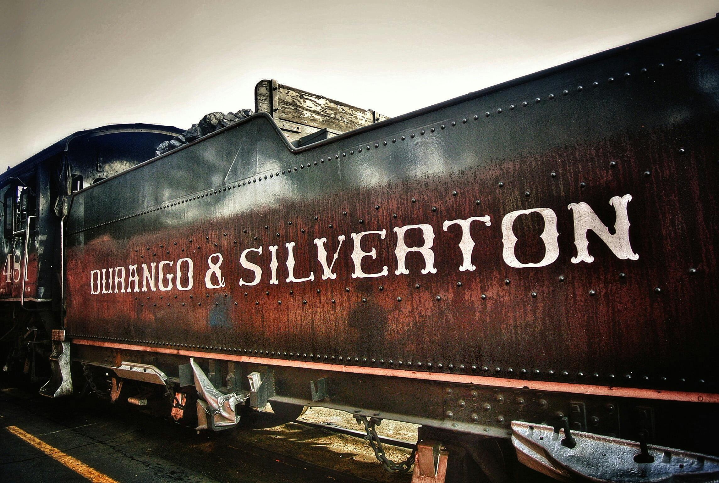 Vintage Durango & Silverton steam locomotive showcasing rustic charm and industrial heritage.