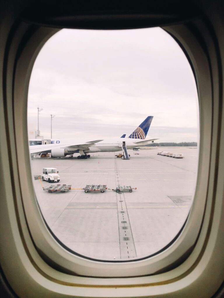 A commercial airplane seen through a window at Munich Airport, Germany.