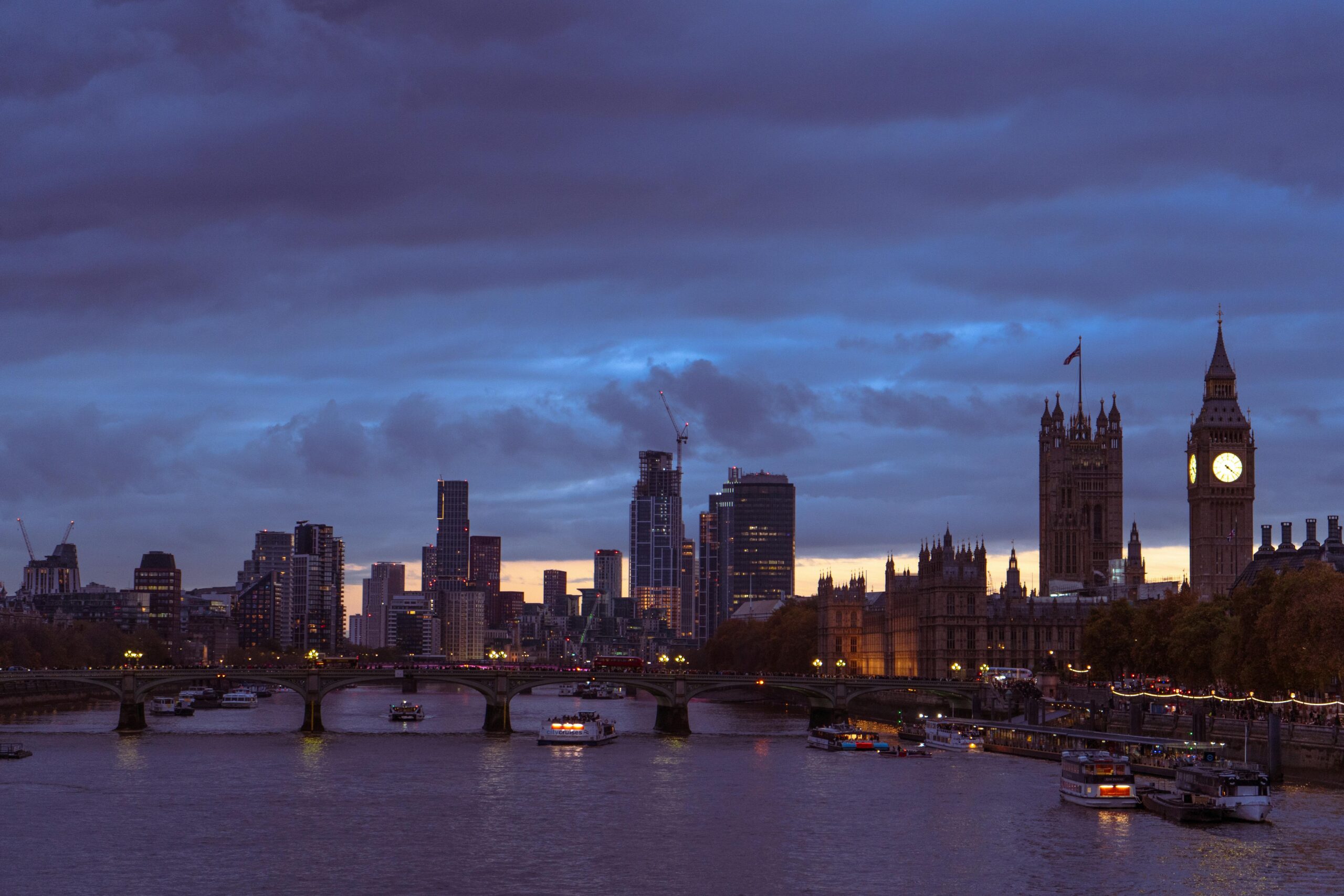 A stunning view of London's skyline at dusk, featuring Big Ben and the River Thames.