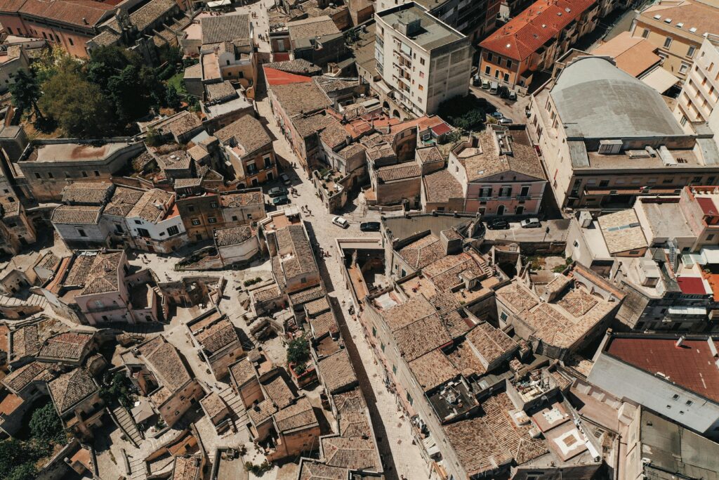 Aerial view of aged stone residential houses located in living district of old town