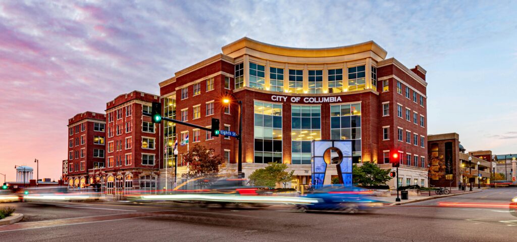 Colorful twilight view of downtown Columbia, Missouri capturing urban life and modern architecture.