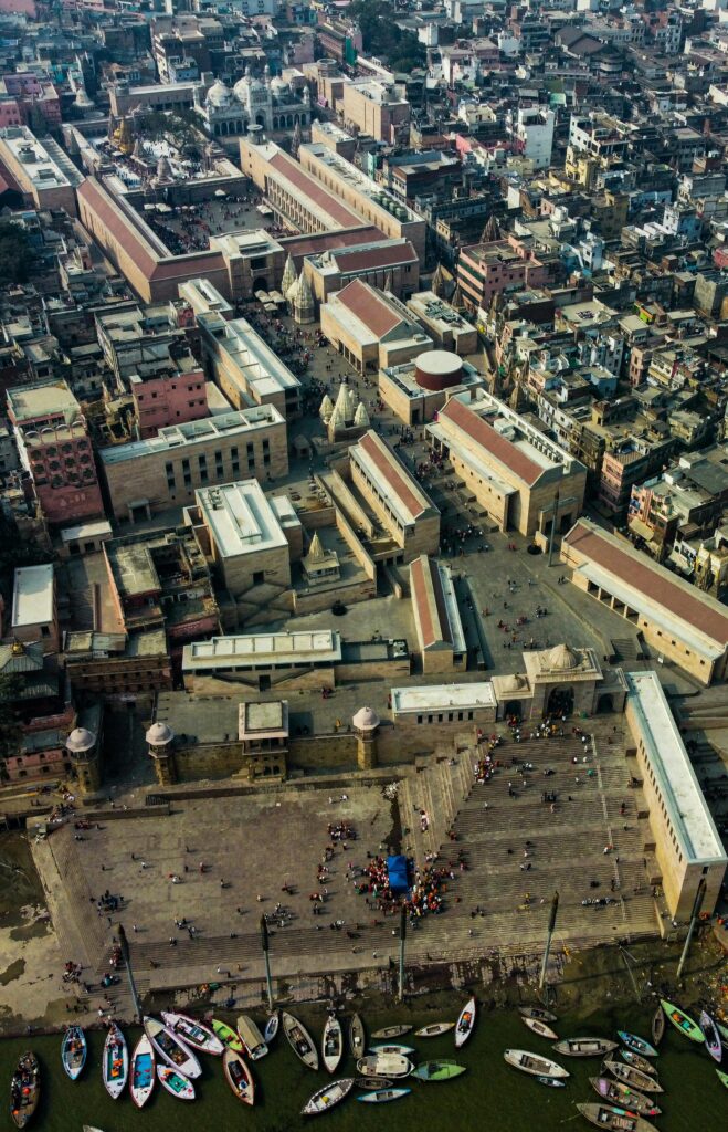 Aerial view showcasing the Kashi Vishwanath Corridor with the bustling cityscape of India.