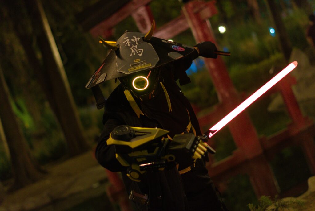 A captivating image of a futuristic samurai warrior cosplay illuminated by neon lights in a night environment.