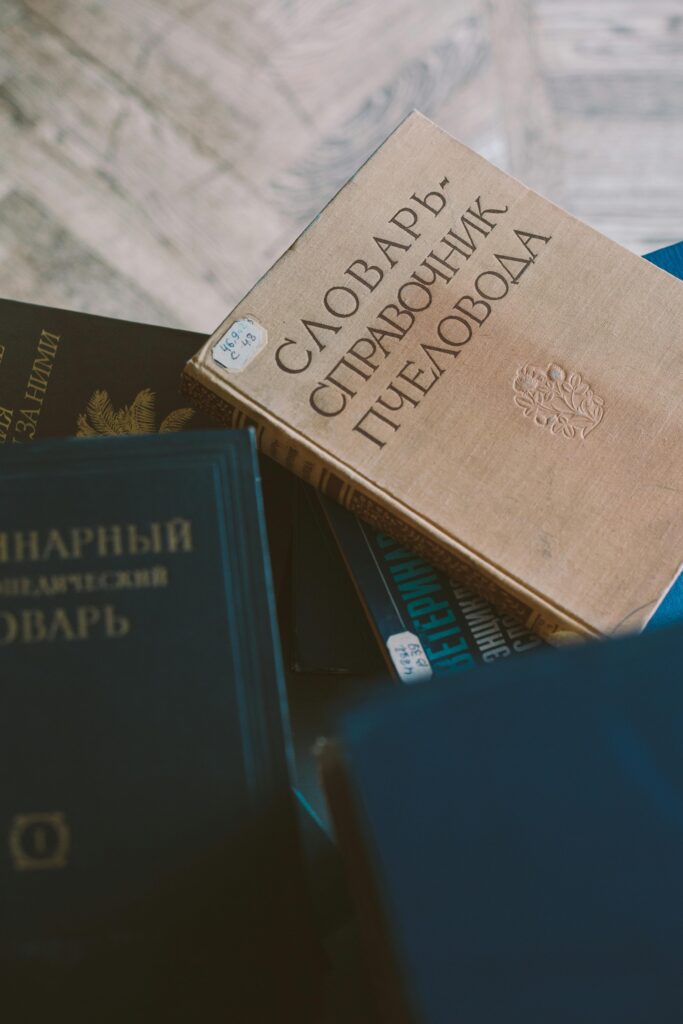 A collection of vintage books with Cyrillic script, epitomizing knowledge and literature.