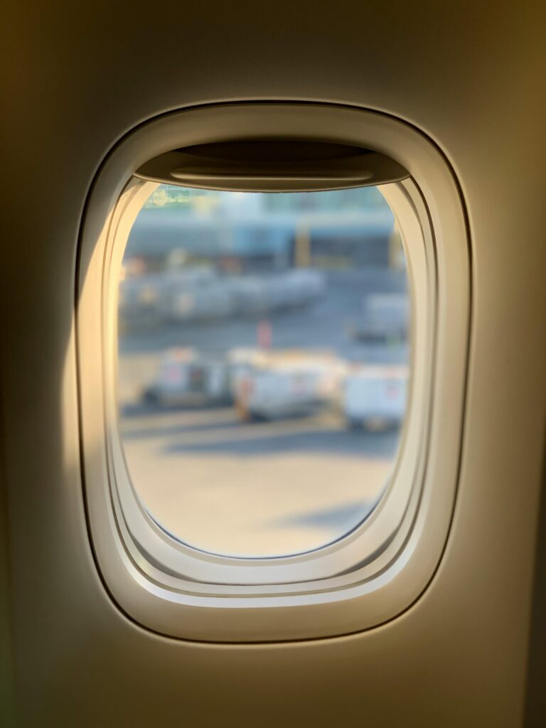 View from an airplane window overlooking the tarmac at Richmond Airport, BC, Canada.