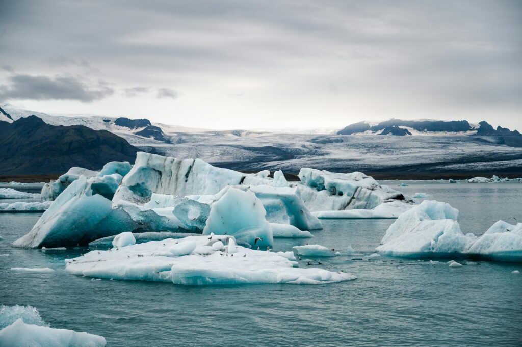 Breathtaking view of icebergs floating on Jökulsárlón Lagoon in Iceland, showcasing natural beauty.